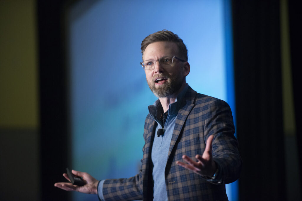 Shawn Ellis, Resilience Keynote Speaker and Change Management Expert, engaging an audience from a stage